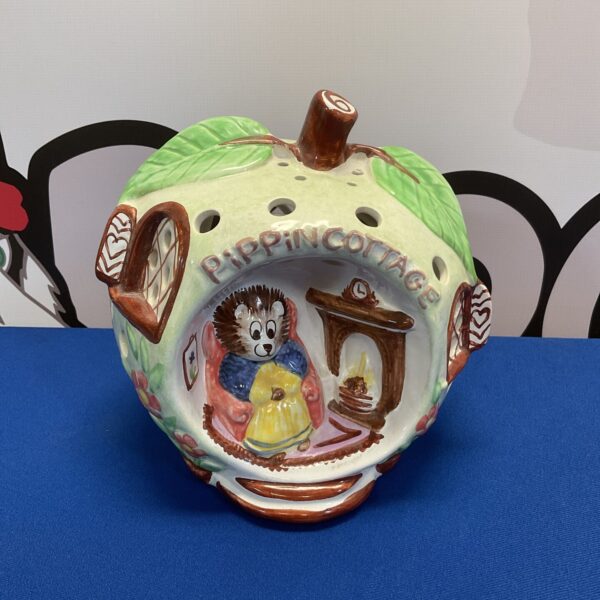 Vintage ceramic Pippin cottage table lamp with painted details.
