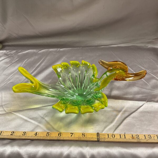 Vibrant Murano glass duck dish with green and yellow swirls.
