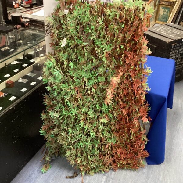 Realistic artificial hedge panel for garden privacy screening.