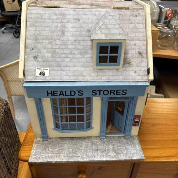 Front view of vintage Heald’s Stores dolls house for restoration.