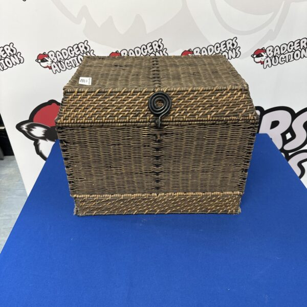 Vintage wicker storage box with woven detail, ideal for home organisation.