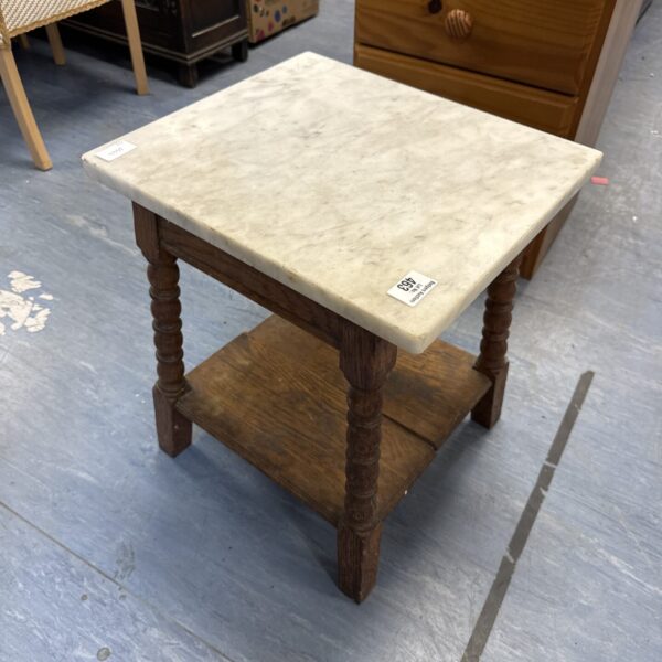 Vintage marble top barley twist table with carved legs.