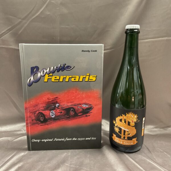 “Bowtie Ferraris” book and bottle of “Gold Teeth” beer for collectors.