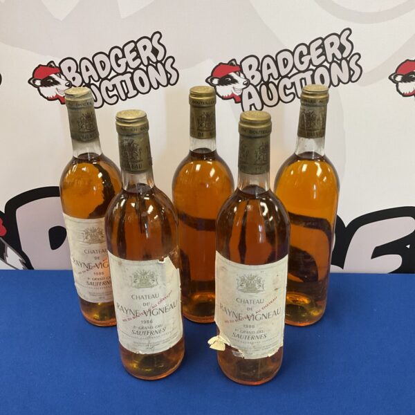 Five bottles of Chateau de Rayne Vigneau 1986 vintage wine.
