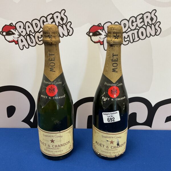 Two bottles of Moët & Chandon champagne in original packaging.