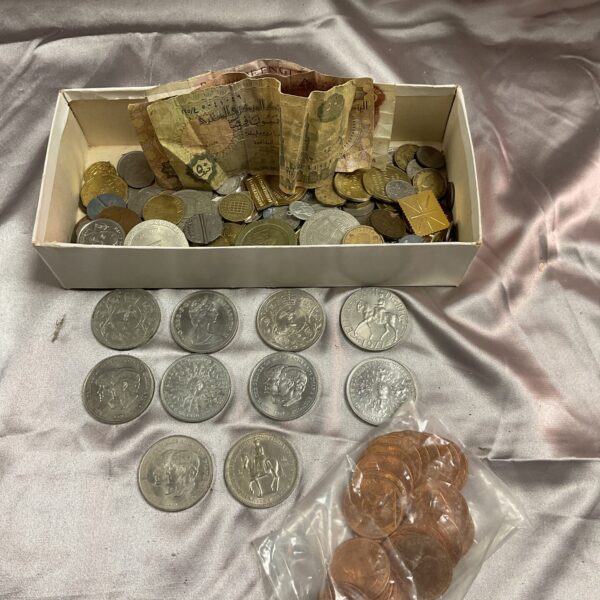 Assorted coin and note lot with commemorative coins and vintage currency.