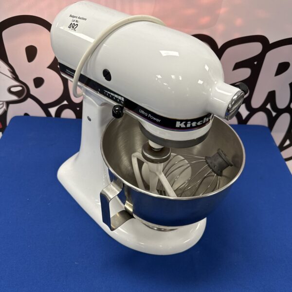 Silver KitchenAid KSM90 professional stand mixer for baking.
