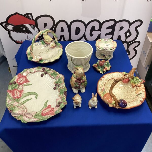 Vintage Fitz and Floyd pottery collection with animal and floral designs.