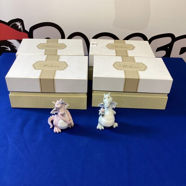 Four boxes of Welino hand made dragon figures.