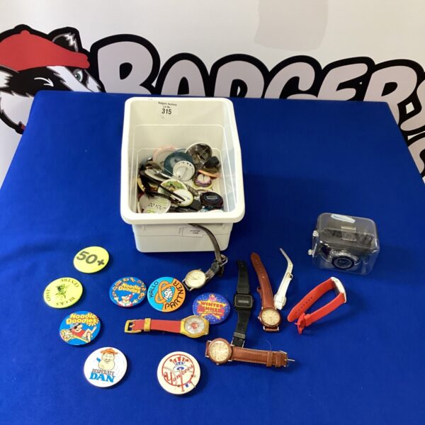 Box of mixed watches and badges