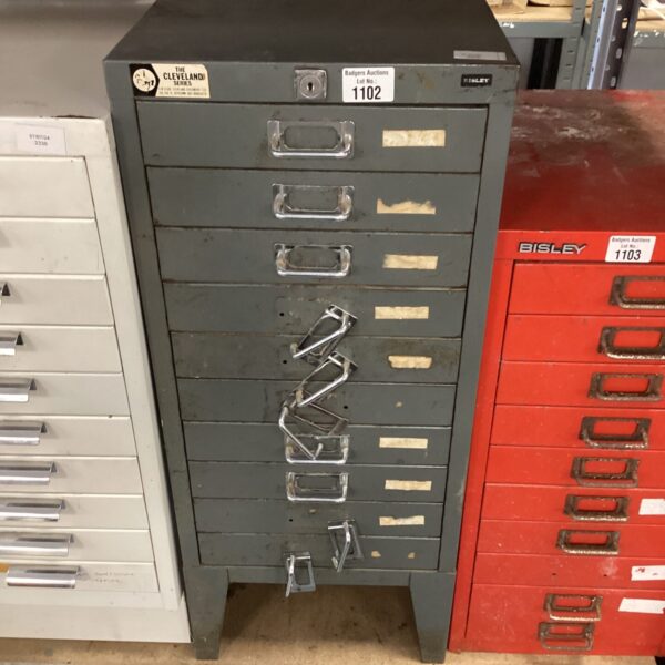 Vintage metal Bisley filing cabinet with multiple drawers.