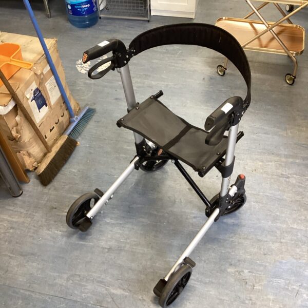 Silver mobility walker with a black seat, side view.