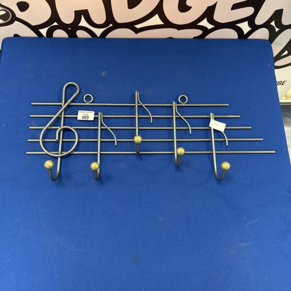 Vintage musical coat hook rack with quaver shaped hooks.