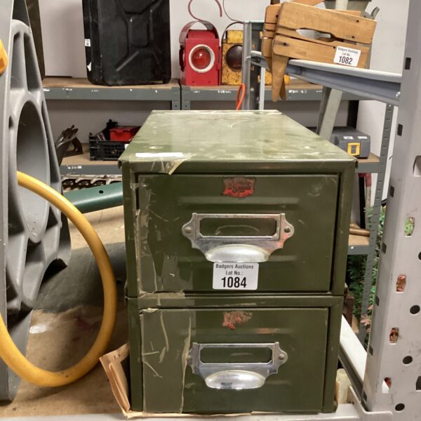 Vintage metal card index drawers with labels, ideal for office storage.