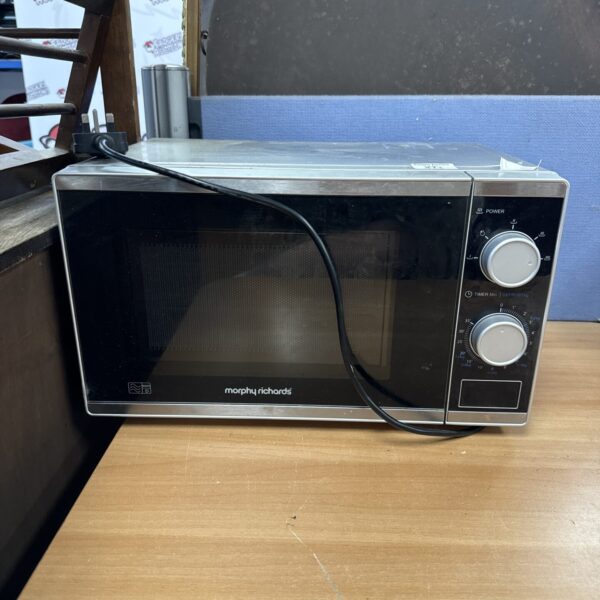 Black Morphy Richards microwave with dial controls.