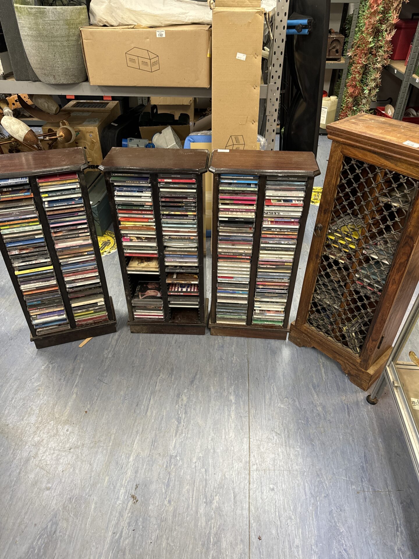 678 Four wooden cd racks with contents