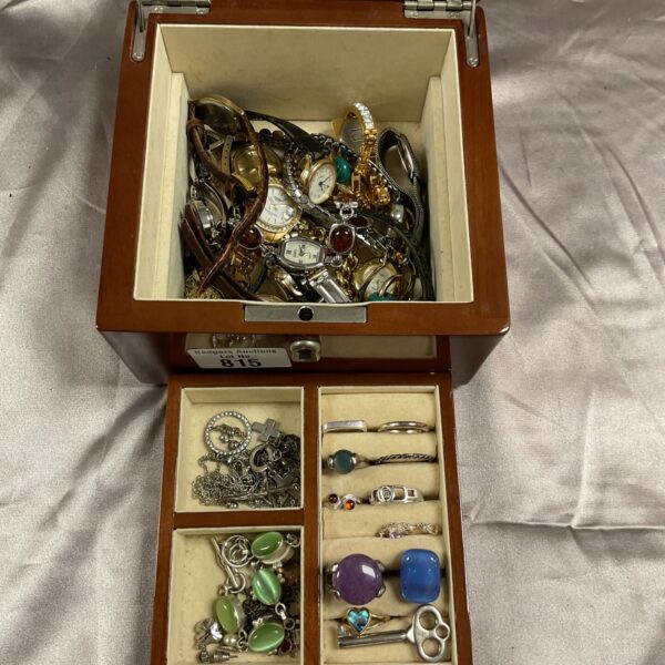 Vintage wooden jewellery box filled with costume jewellery and trinkets.
