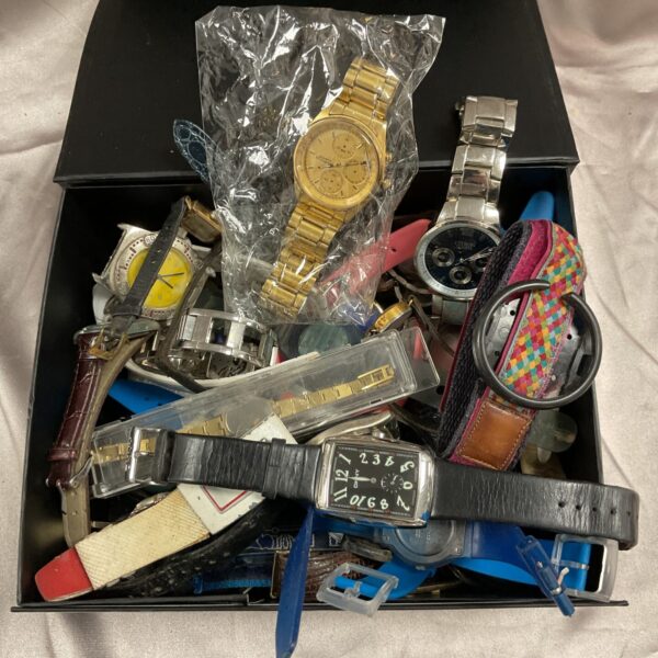 Assorted wristwatches and watch parts in a mixed lot for collectors.