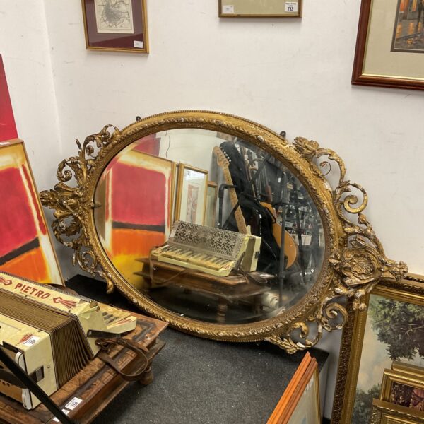 Large antique gilt framed mirror needing restoration.