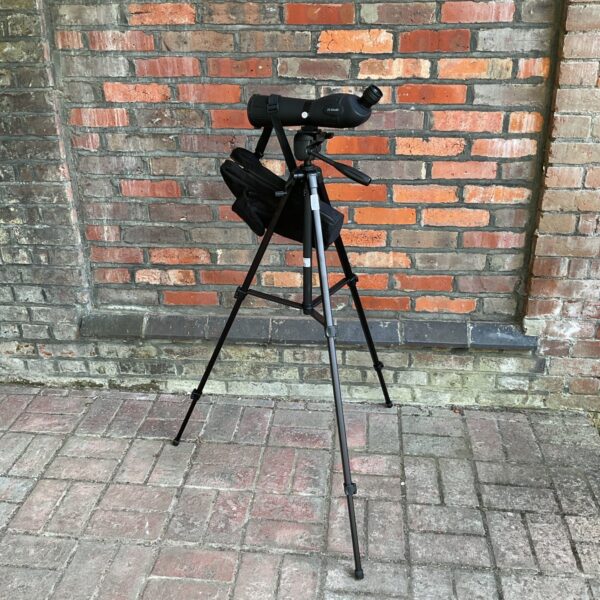 Spotting scope on Velbon tripod for birdwatching and outdoor observation.