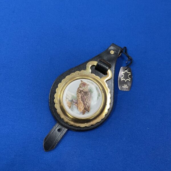 Vintage horse brass fob with ceramic owl design.