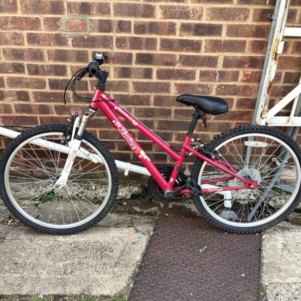 Red Apollo Entice girls’ mountain bike in used condition.