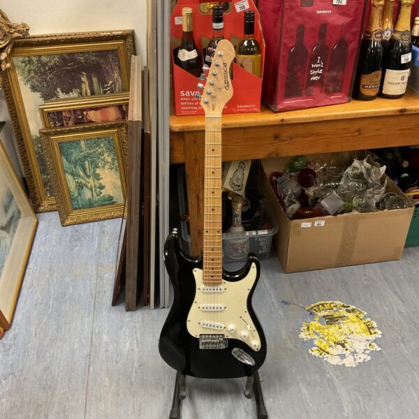 Black Elevation electric guitar, a classic musical instrument.