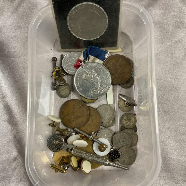 Mixed lot of vintage British coins and medals for collectors.
