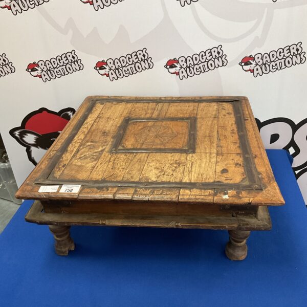Antique Indian bajot low table with distressed wood finish.
