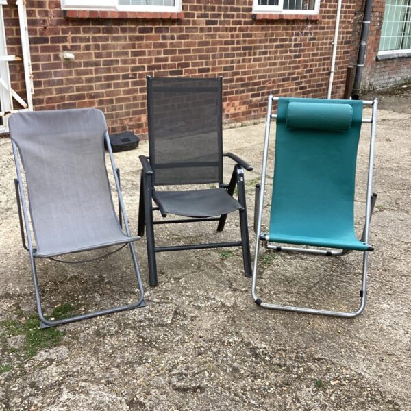 Grey garden folding chair for outdoor use.