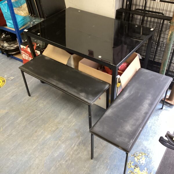 Modern glass topped dining set with benches for kitchen or dining room.