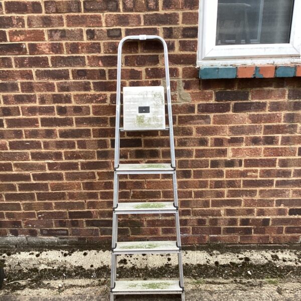 Vintage aluminium step ladder with three steps, ideal for DIY projects.