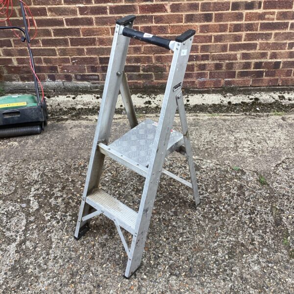 Silver aluminium step ladder with two steps, side view.