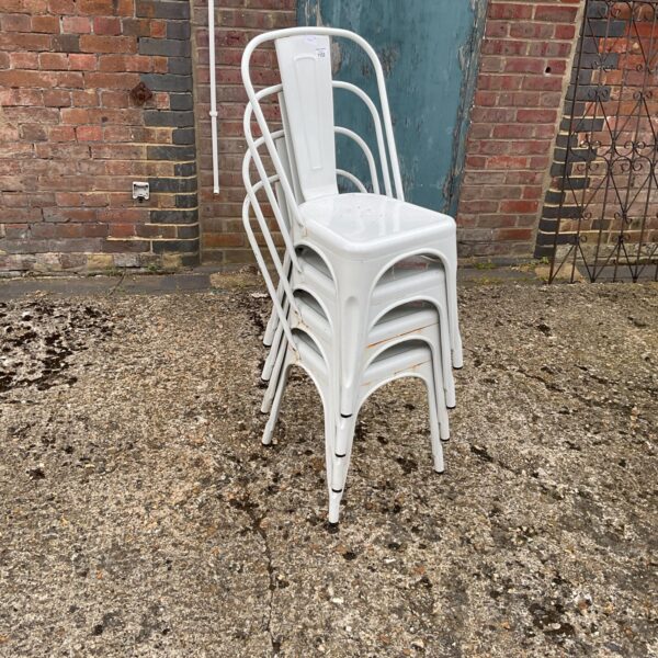 Vintage stacking metal garden chairs for outdoor use.