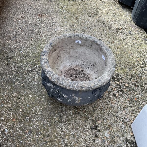 Large weathered garden planter, ideal for outdoor plants.