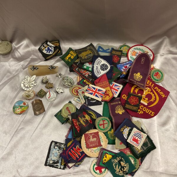 Large collection of vintage scout badges and cloth patches.
