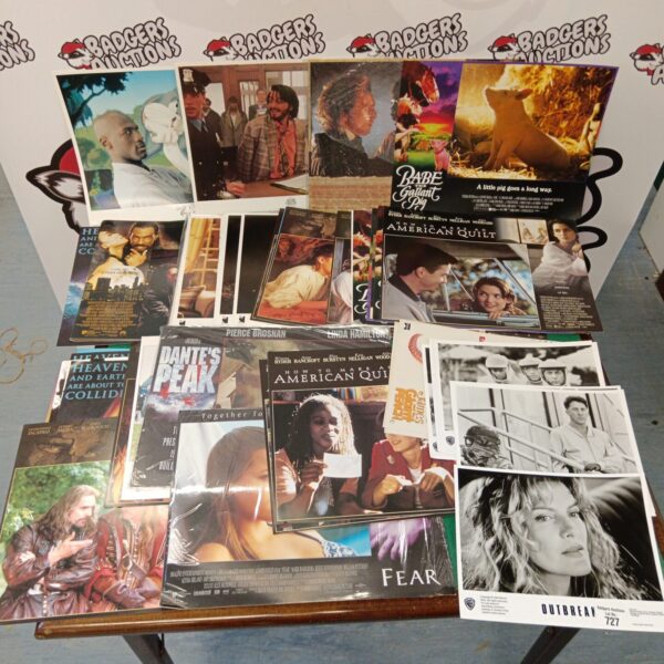Vintage cinema lobby card collection including Space Jam and Dante's Peak.