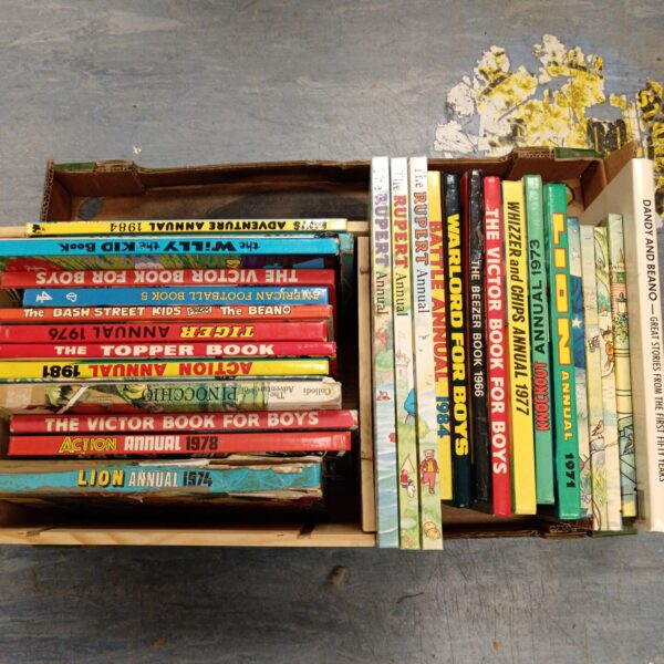 Vintage collection of childrens annuals including Rupert and Topper.