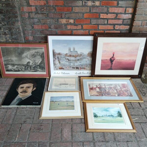 Collection of vintage framed prints and artwork, including landscape scenes.