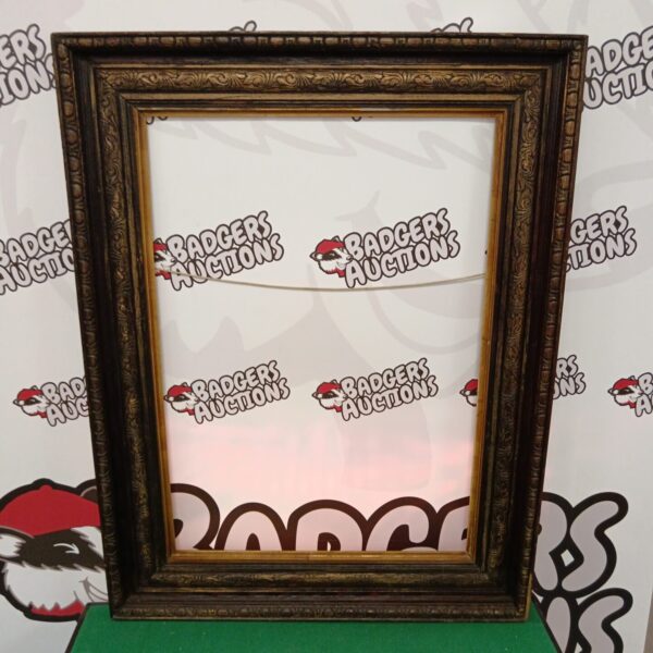 Ornate antique carved wooden picture frame measuring 88cm x 67cm.