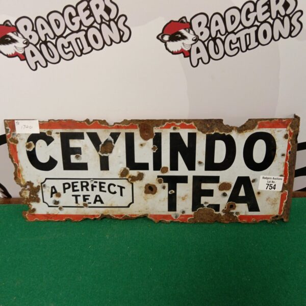 Vintage Ceylindo Tea enamel sign with bold lettering.