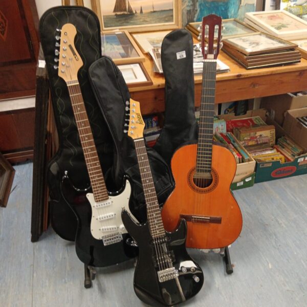 Vintage guitars lot including acoustic and electric instruments.