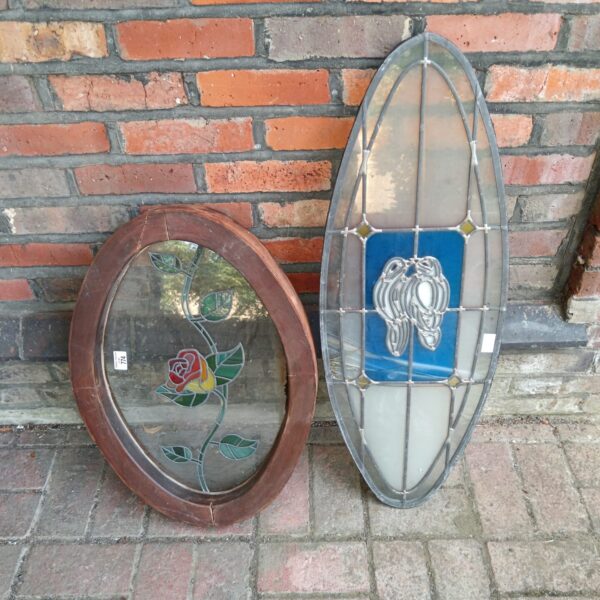 Vintage stained glass window panel with a rose design.