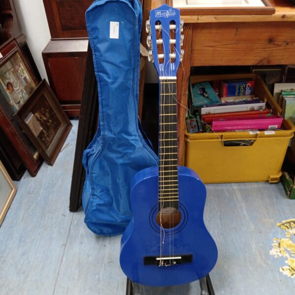 Blue Music Alley child's acoustic guitar with a carrying case.