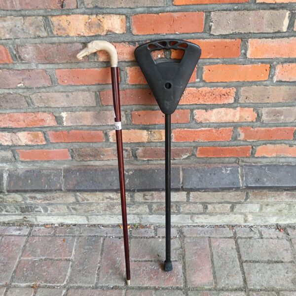 Vintage elephant head walking stick and shooting stick with wooden seat.