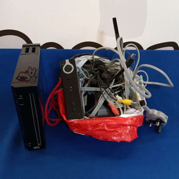 Black Nintendo Wii console with cables and accessories.