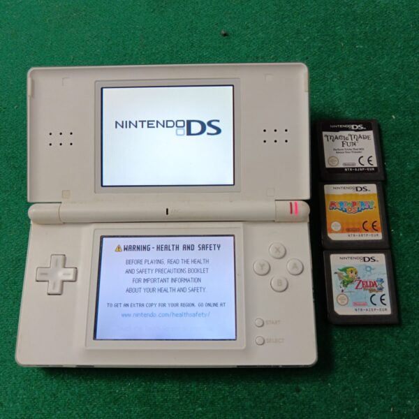 White Nintendo DS Lite handheld console with Zelda game cartridge.