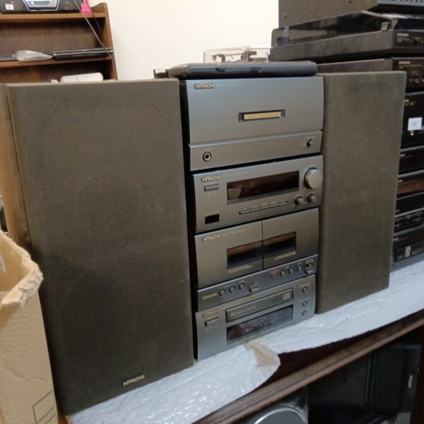 Vintage Hitachi hi-fi system with speakers and remote.
