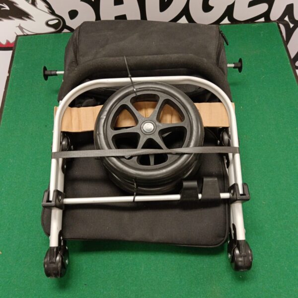 Front view of a black folding shopping trolley with wheels.