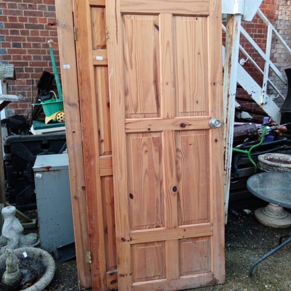Lot of three vintage pine doors, salvaged and ready for restoration.